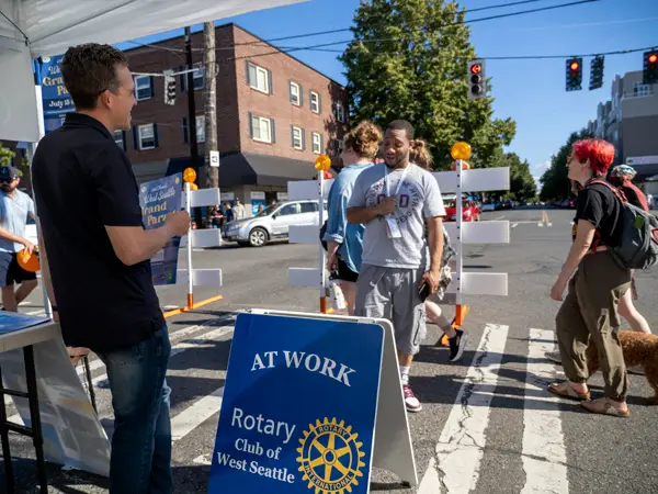 West Seattle SUMMERFEST Booth Attracts Rotary Enthusiasts